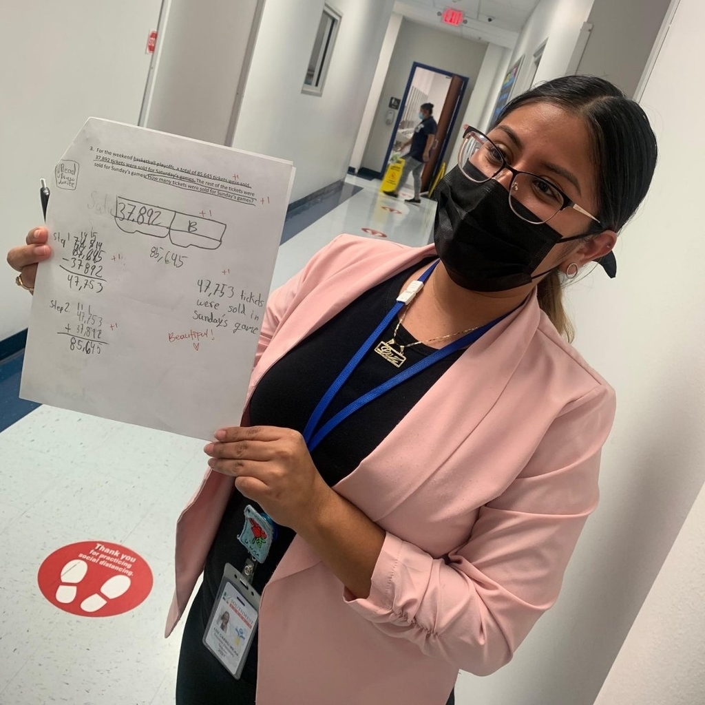 Ms. Carro displaying student’s work.