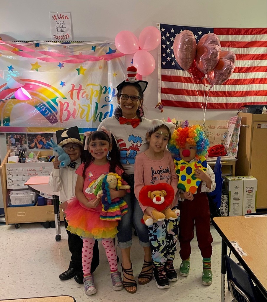 Ms. Quinteros and her students taking a photo together for Dr. Seuss Dress-up Days