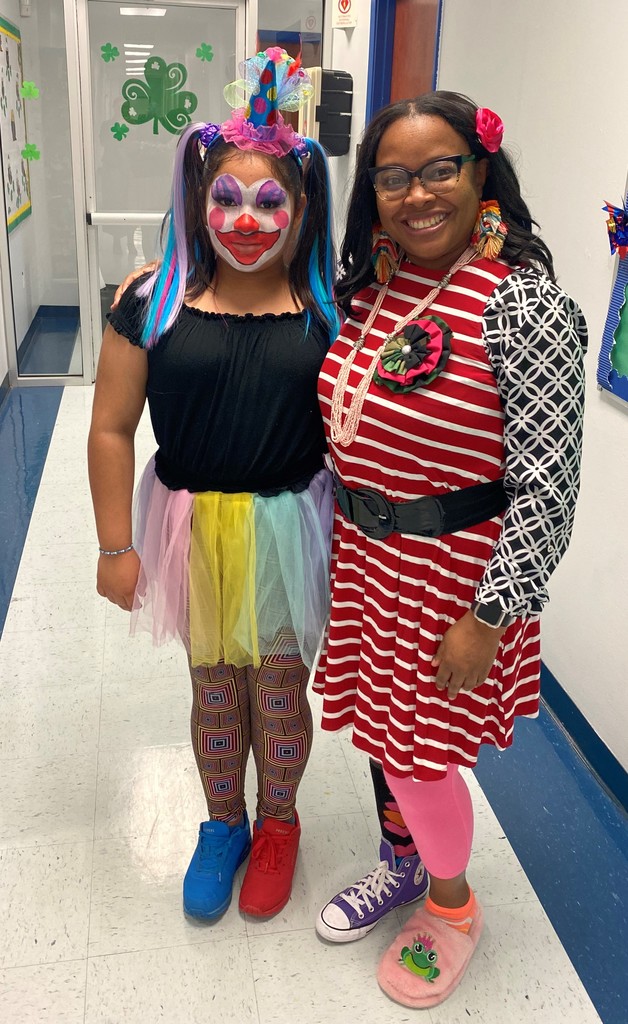 Ms. Johnson with a student dressed-up for Dr. Seuss Dress-up Days