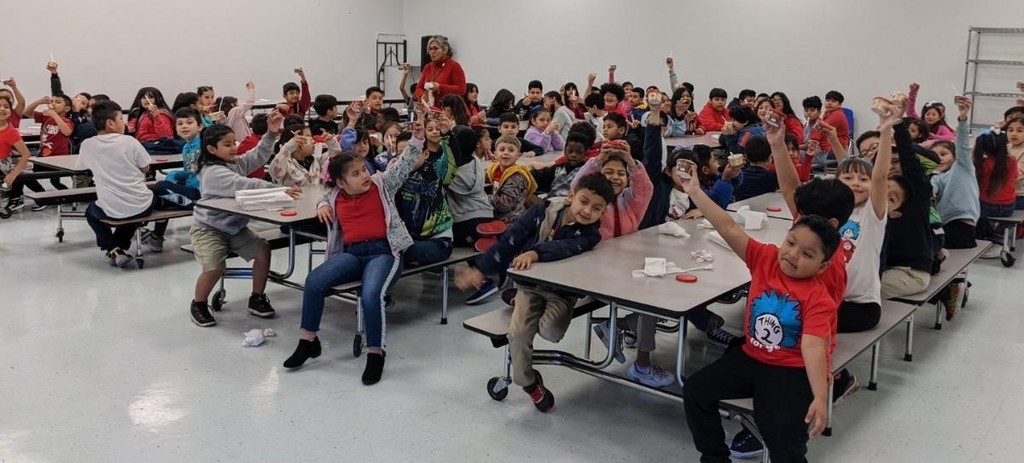 Students happy for having ice cream for a perfect attendance at school