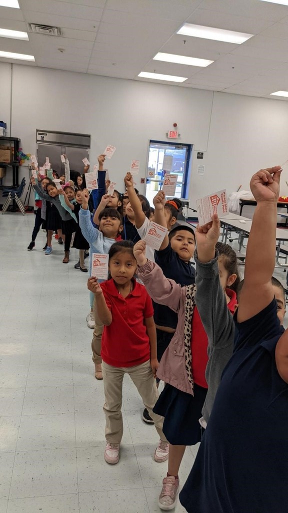 Students lined up after being able to eat ice cream for having a perfect attendance in school